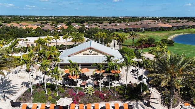 birds eye view of property featuring a water view and a residential view