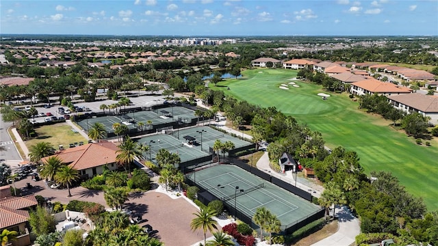 birds eye view of property featuring view of golf course and a residential view