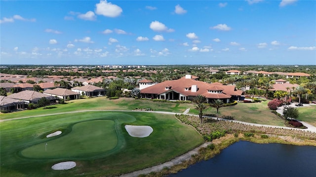 bird's eye view with view of golf course, a water view, and a residential view