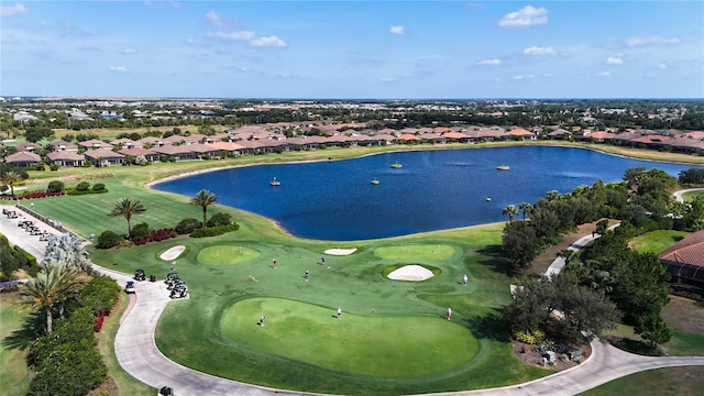 bird's eye view featuring a water view, a residential view, and golf course view