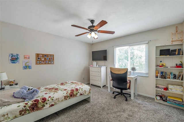 bedroom featuring ceiling fan and light carpet