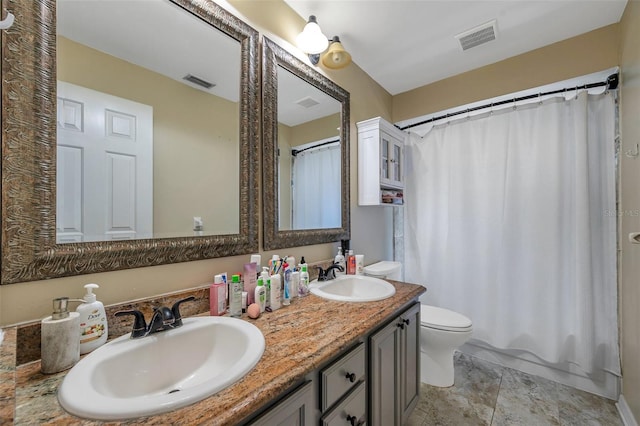 full bathroom with tile patterned flooring, shower / bath combination with curtain, toilet, and vanity