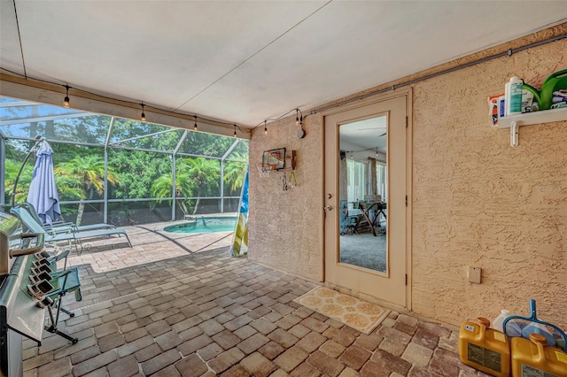 view of patio / terrace with a lanai