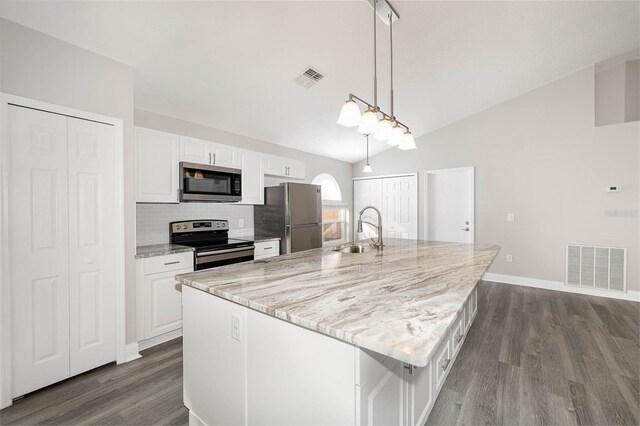 kitchen with stainless steel appliances, sink, white cabinets, dark hardwood / wood-style flooring, and vaulted ceiling