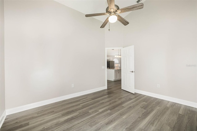 unfurnished room with ceiling fan, high vaulted ceiling, and hardwood / wood-style floors