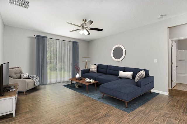 living room featuring ceiling fan and hardwood / wood-style floors