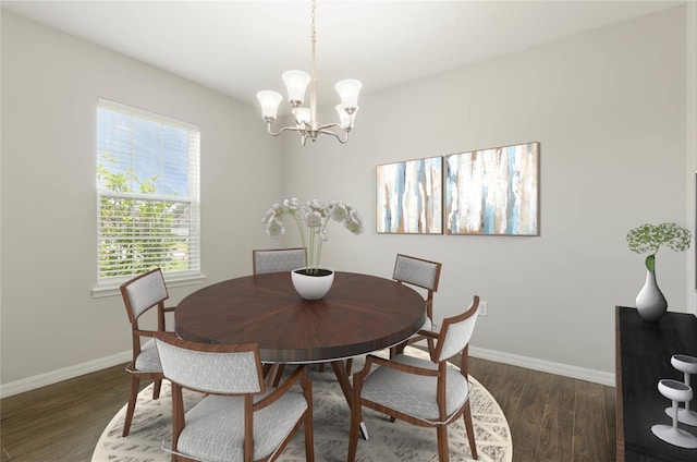 dining space featuring dark hardwood / wood-style flooring and an inviting chandelier