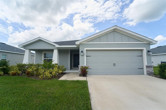 single story home featuring a garage and a front lawn