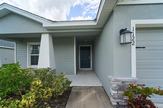 property entrance with a garage