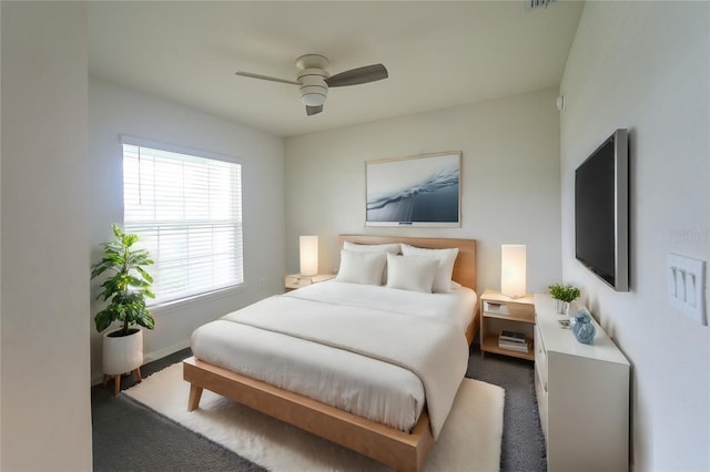 bedroom featuring ceiling fan and carpet flooring