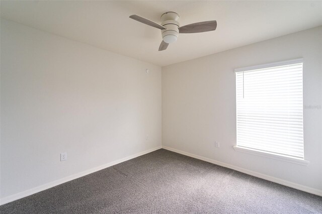 carpeted empty room with ceiling fan