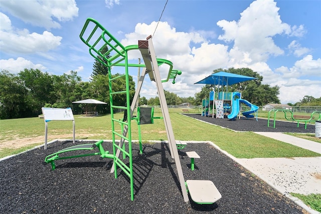 view of jungle gym featuring a lawn