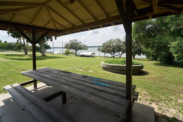 view of home's community featuring a gazebo, a lawn, and a water view