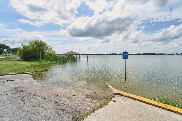 property view of water with a dock