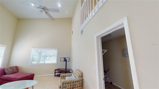 sitting room featuring plenty of natural light, ceiling fan, and light tile patterned floors