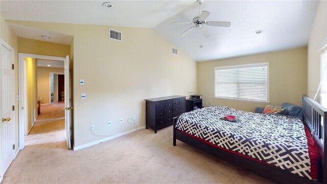 carpeted bedroom featuring vaulted ceiling and ceiling fan