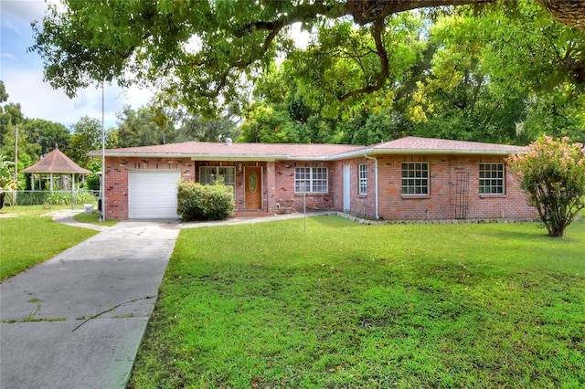 single story home with a garage and a front lawn