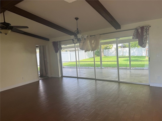 unfurnished room with ceiling fan with notable chandelier, a wealth of natural light, beam ceiling, and baseboards