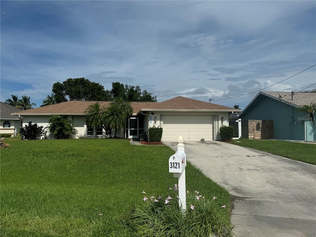 ranch-style house featuring a garage and a front lawn