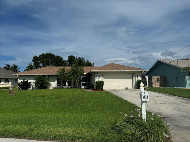 ranch-style house featuring a front yard and a garage