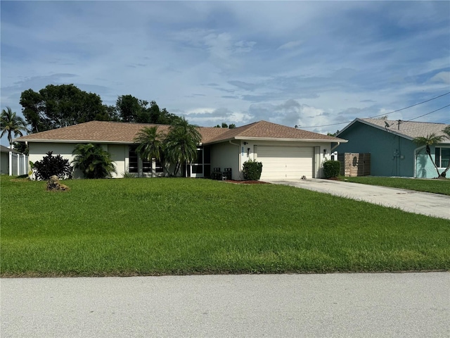 ranch-style house featuring concrete driveway, an attached garage, a front lawn, and stucco siding