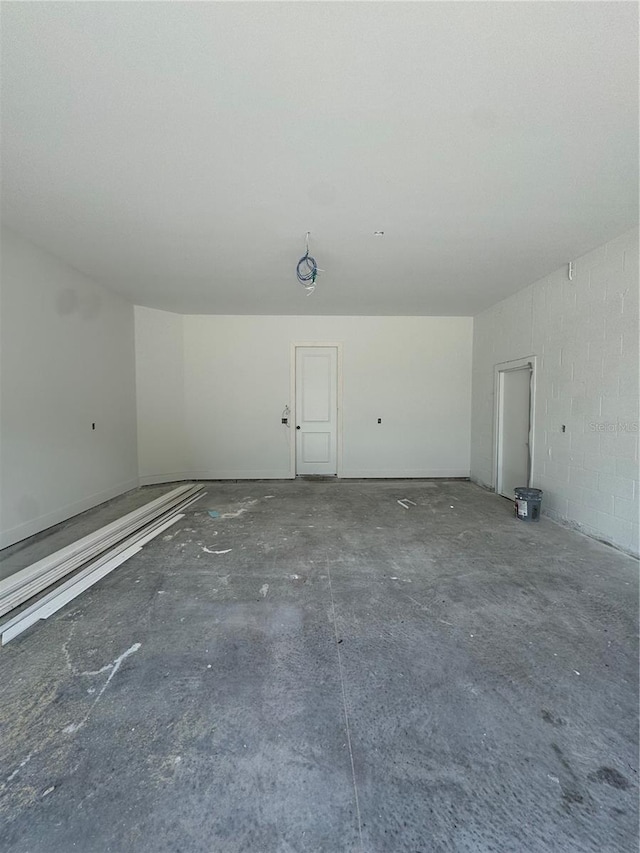 garage featuring concrete block wall