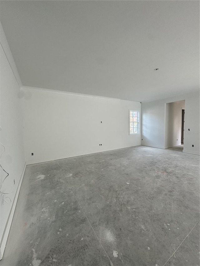 unfurnished room featuring concrete floors
