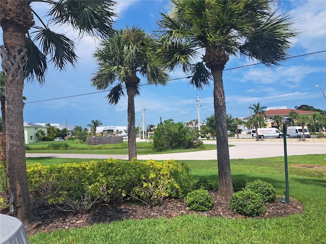 community sign featuring a lawn