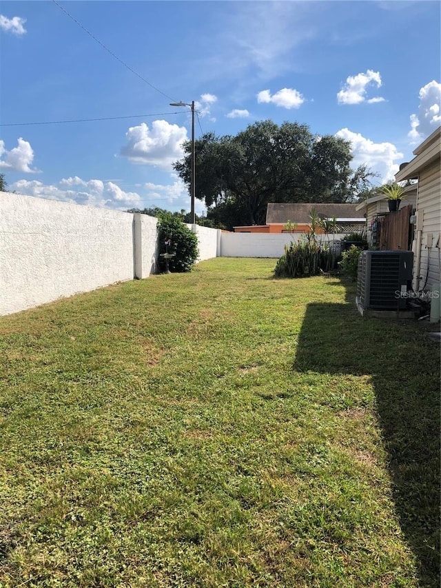 view of yard featuring central AC