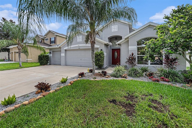 view of front of property with a garage and a front lawn