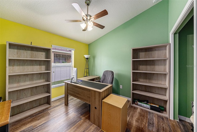 office area with lofted ceiling, ceiling fan, a textured ceiling, and dark wood-type flooring