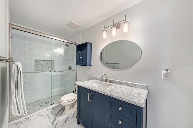 bathroom with marble finish floor, toilet, vanity, and a shower stall