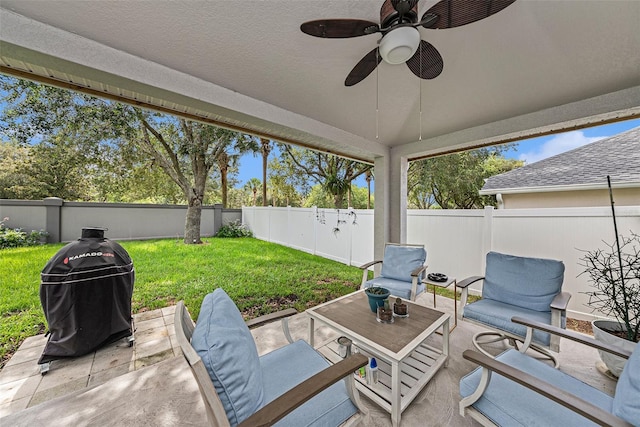 view of patio featuring a ceiling fan and a fenced backyard