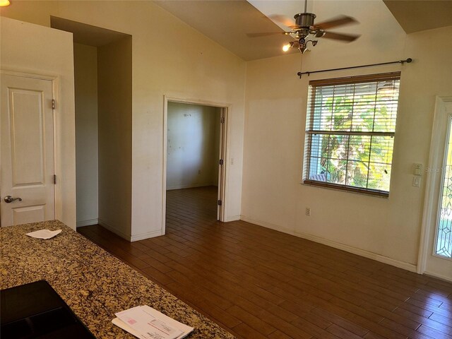 interior space with lofted ceiling, dark hardwood / wood-style flooring, and ceiling fan