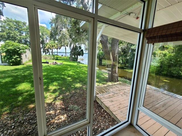 entryway featuring plenty of natural light and a water view