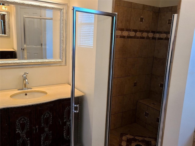 bathroom featuring a stall shower and vanity