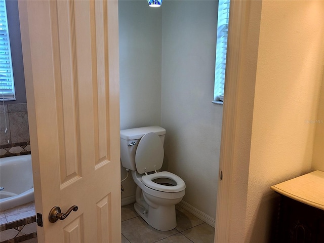 bathroom featuring tile patterned flooring and toilet