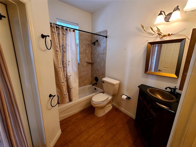 full bathroom with vanity, toilet, hardwood / wood-style floors, and shower / bath combo