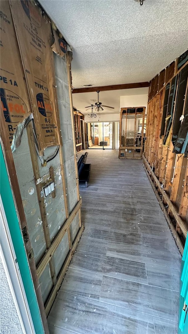 interior space with hardwood / wood-style floors and a textured ceiling