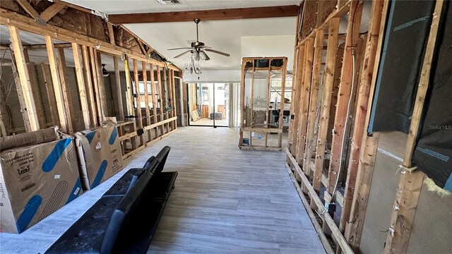 misc room with vaulted ceiling with beams, wood-type flooring, and ceiling fan