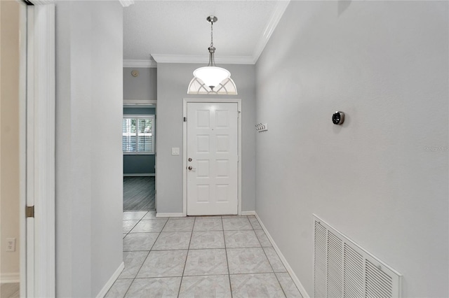 tiled foyer with ornamental molding