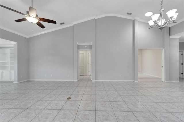 empty room featuring ceiling fan with notable chandelier, crown molding, and vaulted ceiling