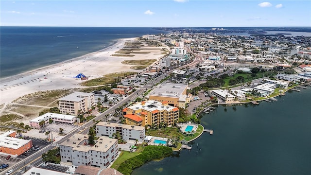 birds eye view of property featuring a view of the beach and a water view