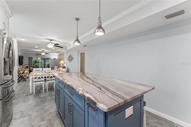 kitchen featuring decorative light fixtures, blue cabinetry, light tile patterned floors, stainless steel fridge, and ceiling fan