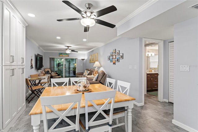 dining room featuring ceiling fan, crown molding, and light tile patterned floors