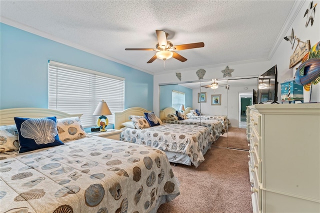 bedroom with ornamental molding, a textured ceiling, a closet, ceiling fan, and light carpet