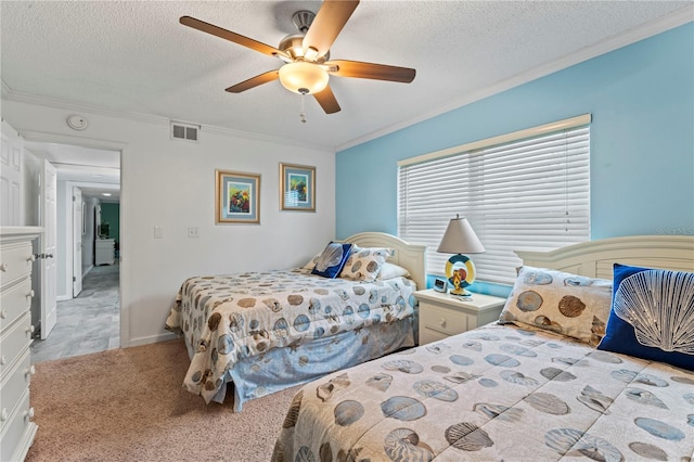 bedroom with a textured ceiling, ceiling fan, crown molding, and light carpet