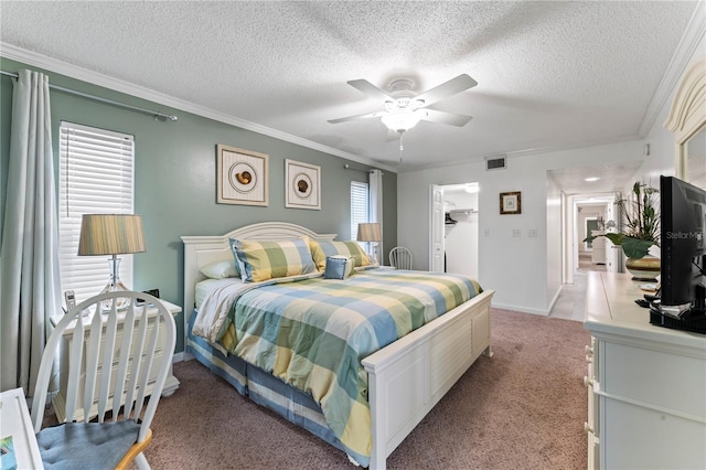 carpeted bedroom featuring a spacious closet, a closet, ceiling fan, and multiple windows