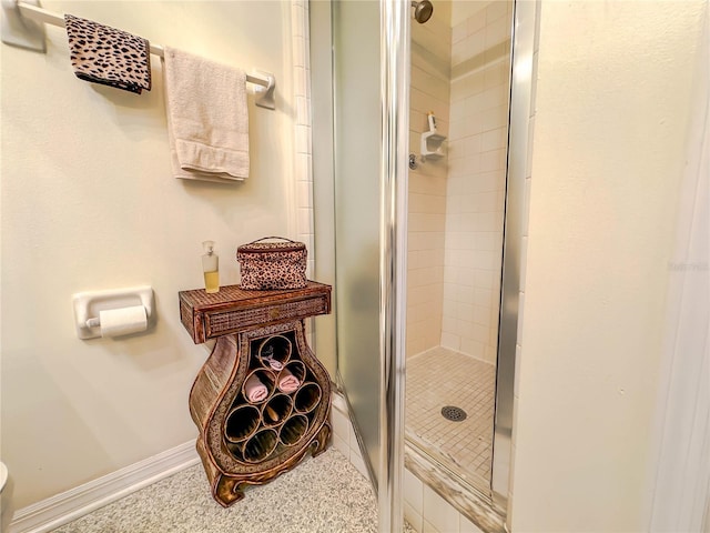 bathroom with tile patterned floors and walk in shower