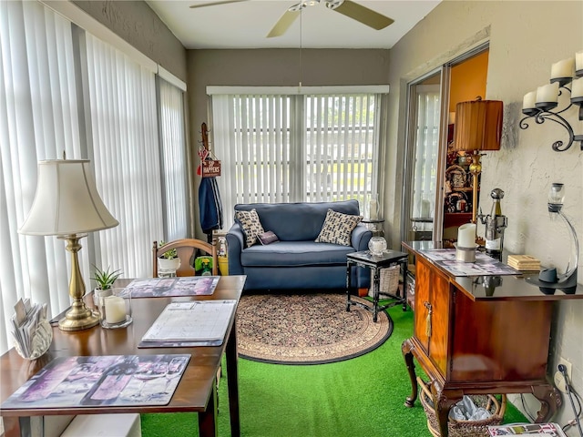 sunroom featuring ceiling fan